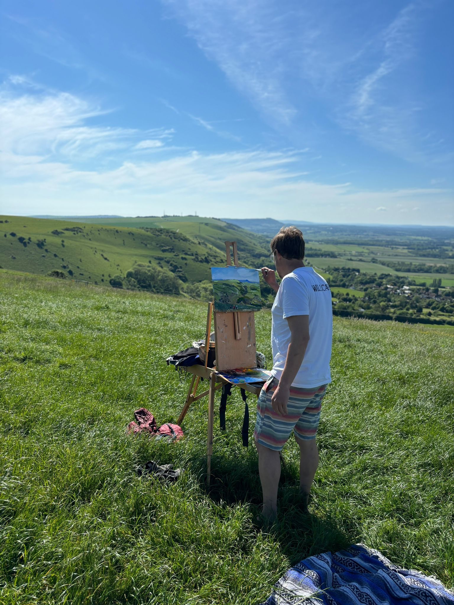 Photo of Jonny painting en plein air on the South Downs near Brighton